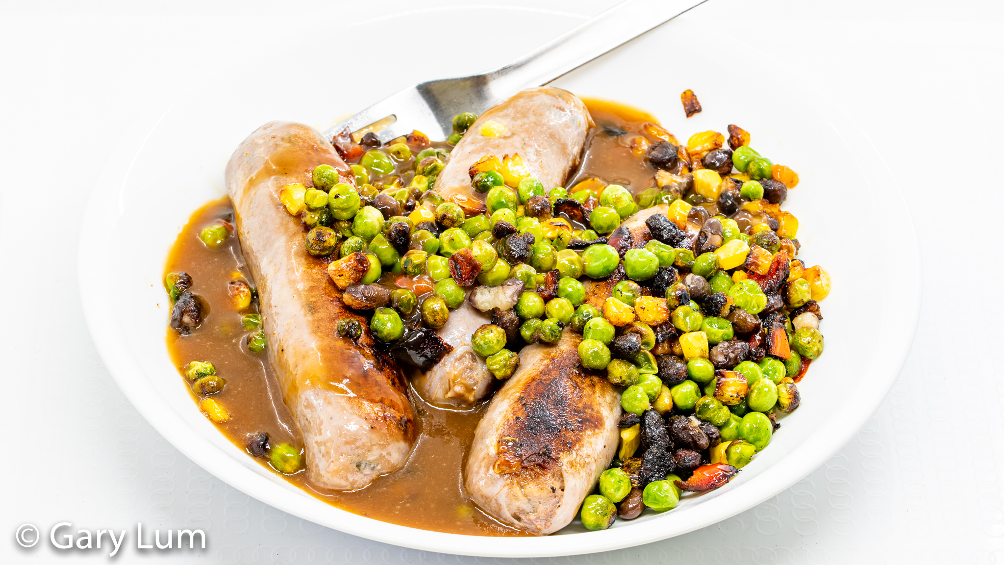Beef sausages with frozen vegetables and Gravox™ gravy. Gary Lum.