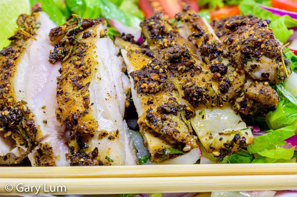 Close up. Pan-fried deboned chicken thigh and salad. Gary Lum.