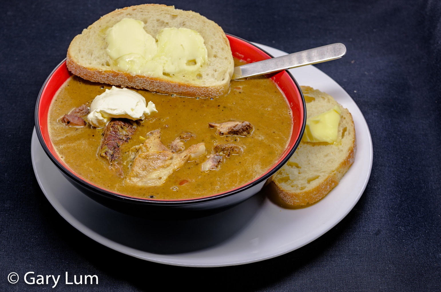 Irish stew cum soup with bread, butter, and sour cream.