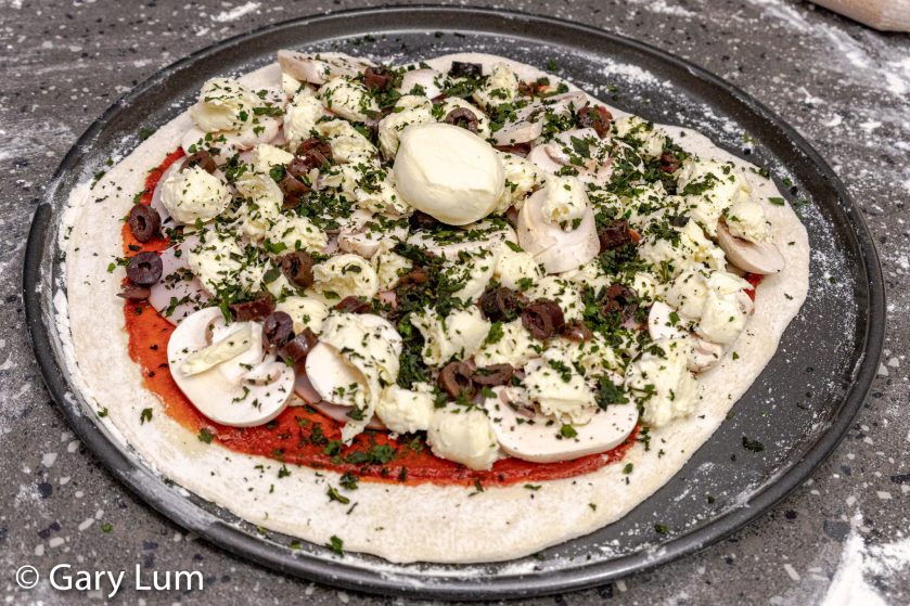 Ham, bocconcini, Kalamata olives, mushroom pizza